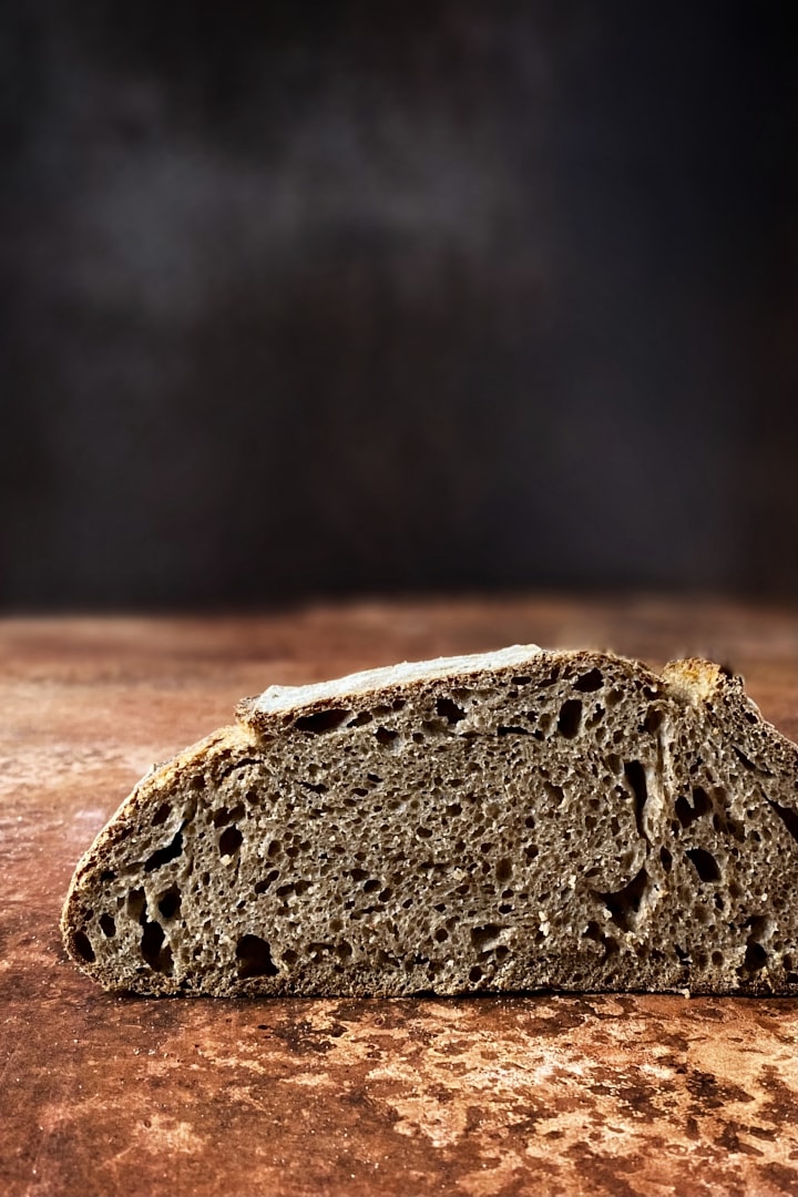 Crumb shot of a dark whole wheat sourdough bread.