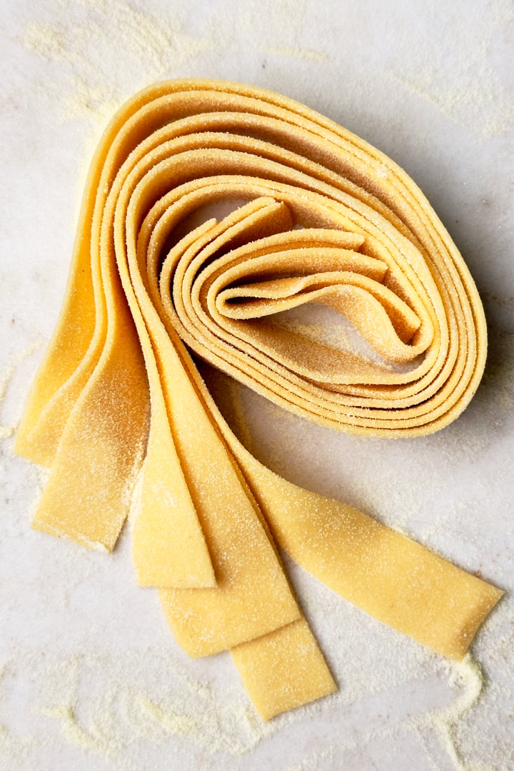 A nest of homemade pappardelle pasta.