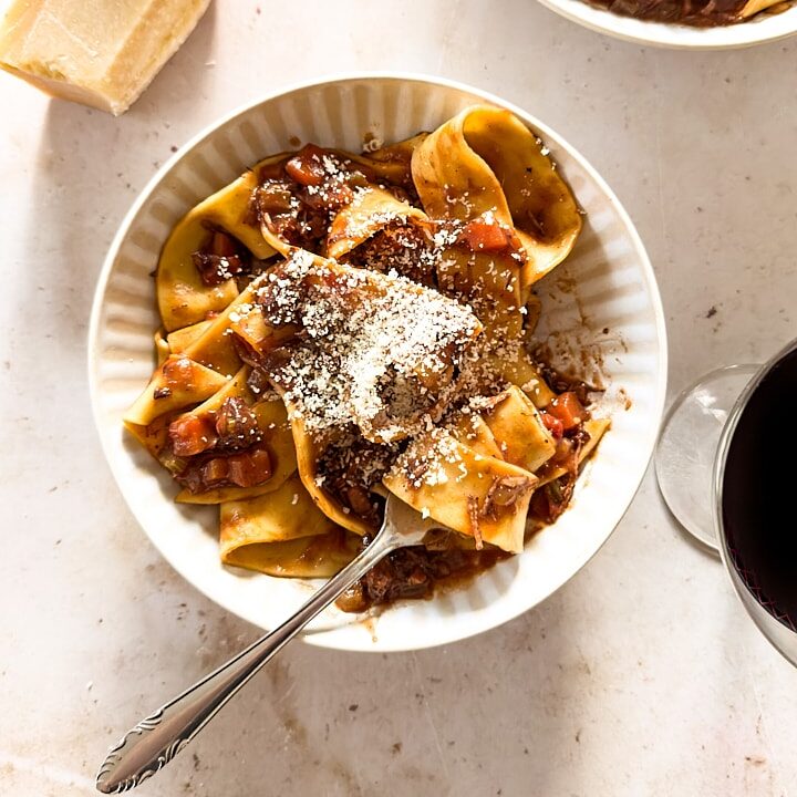 Fresh hand-cut pappardelle with slow-cooked lamb ragu.