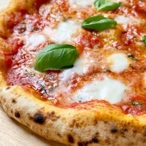 Neapolitan style sourdough pizza with fresh tomato sacue, mozzarella and basil.