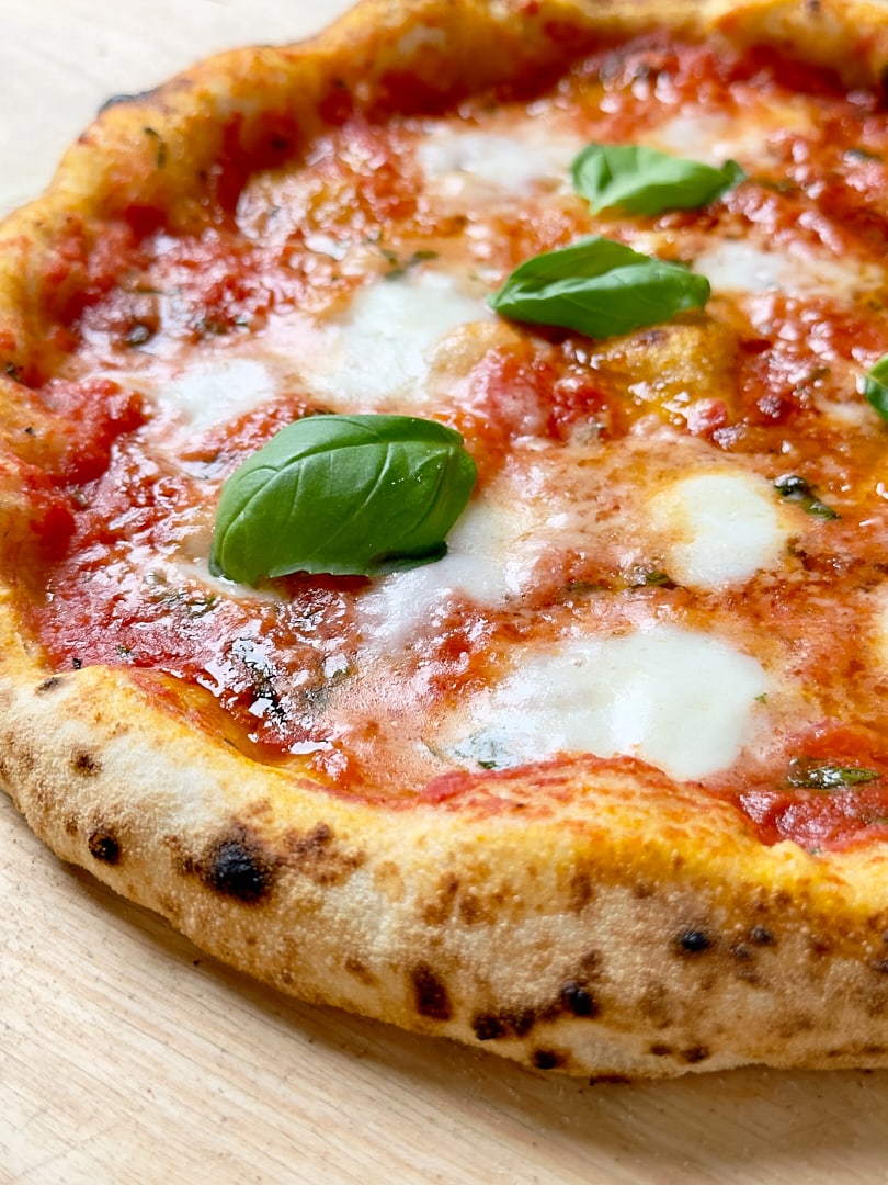 Neapolitan style sourdough pizza with fresh tomato sacue, mozzarella and basil.