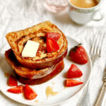 stack of cinnamon swirl french toast with strawberries.