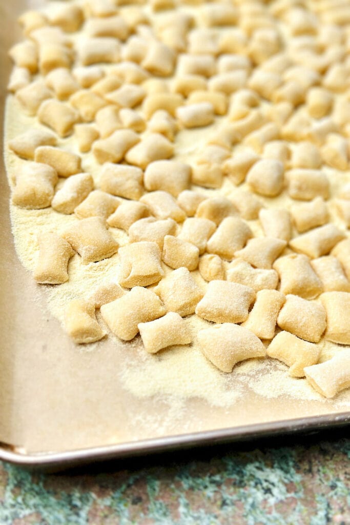 homemade gnocchi di ricotta on a baking tray.