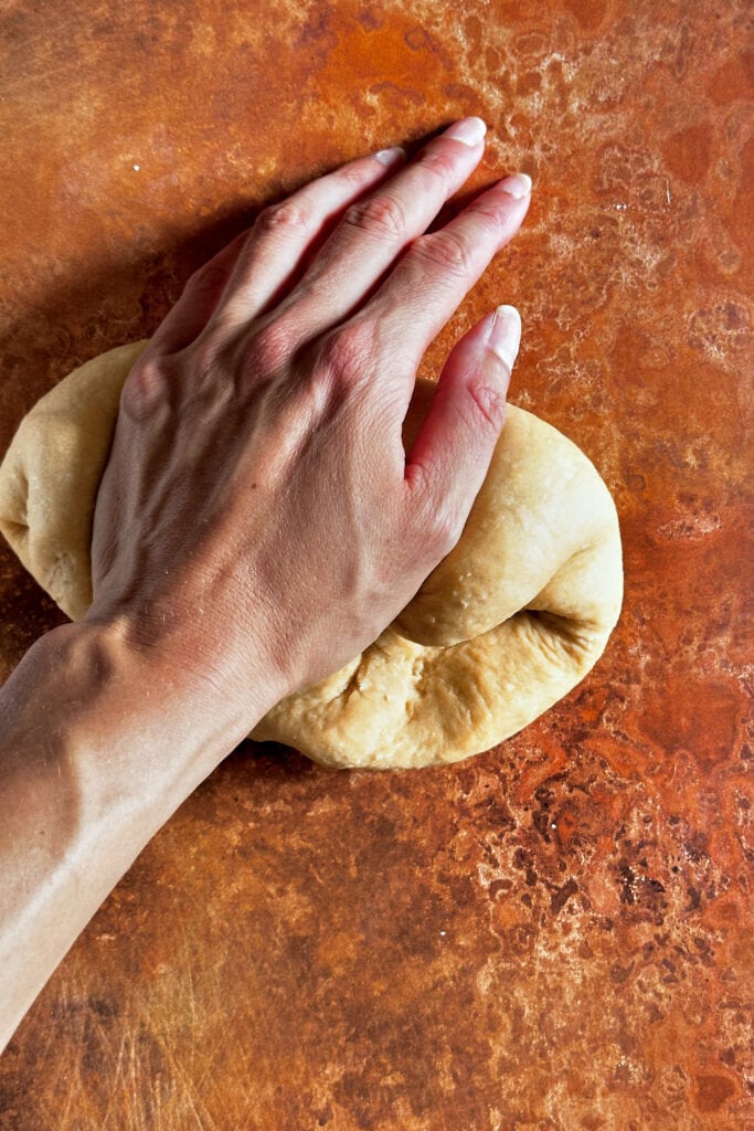 Kneading fresh pasta dough by hand.