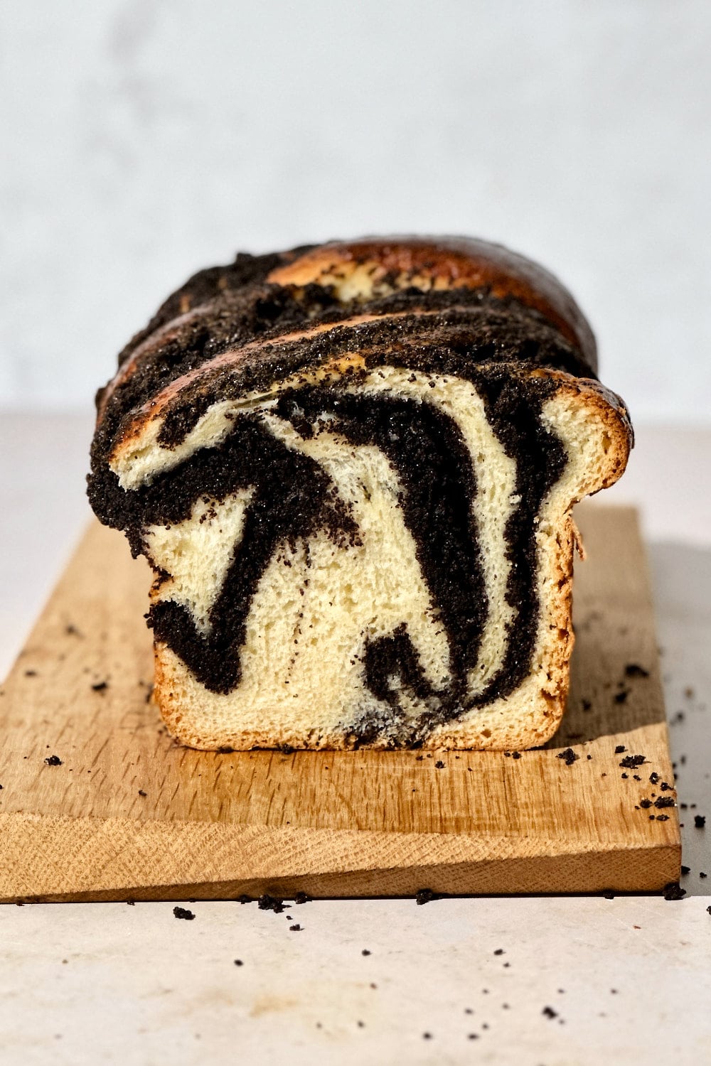 Crumb shot of a sourdough babka with swirls of poppy seed filling.